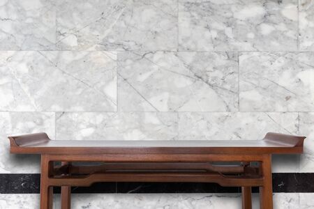 Empty top wooden table and natural stone wall background. For product displayの写真素材