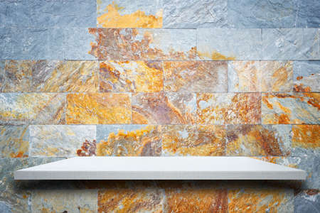 Empty top wooden shelves and stone wall background. For product displayの写真素材