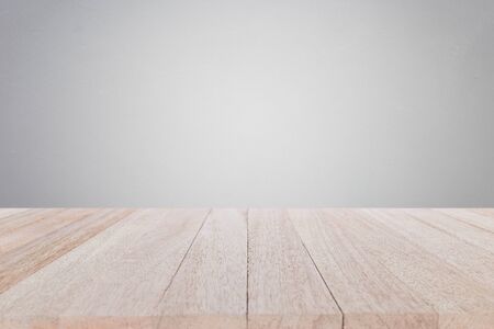 Empty top wooden table and stone wall background. For product display