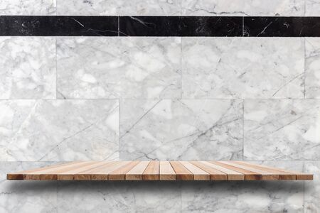 Empty top wooden shelves and stone wall background. For product displayの写真素材