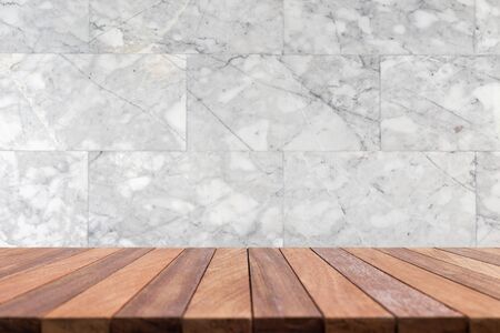 Empty top wooden table and natural stone wall background. For product displayの写真素材