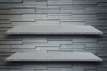 Empty top of natural stone shelves and stone wall background. For product displayの写真素材