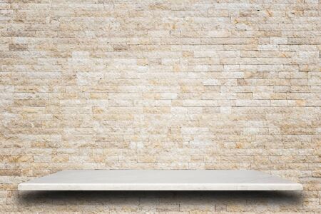 Empty top of natural stone shelves and stone wall background. For product displayの写真素材
