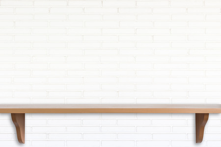 Empty top wooden shelves and stone wall background. For product displayの写真素材