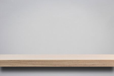 Empty top wooden shelves and stone wall background. For product display