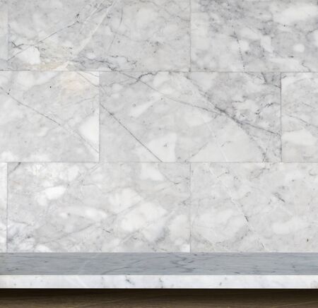 Empty top of natural stone table and stone wall background. For product displayの写真素材