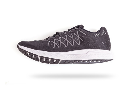 New black sneakers shoe. Taken at studio and isolated on white backgroundの写真素材