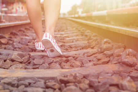 Close up legs of woman walking in railwayの写真素材