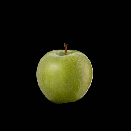 Green apple. Studio shot isolated on black backgroundの写真素材