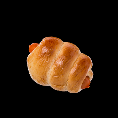 Bread with Sausage. Studio shot isolated on black backgroundの写真素材