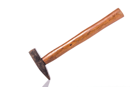 Old steel hammer with wood handle. Studio shot isolated on white backgroundの写真素材