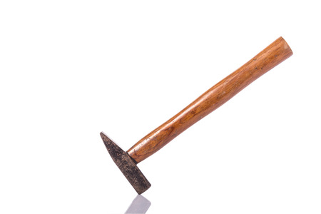 Old steel hammer with wood handle. Studio shot isolated on white backgroundの写真素材