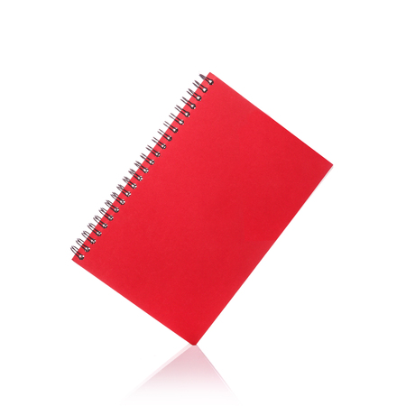 New red note book. Studio shot isolated on white backgroundの写真素材