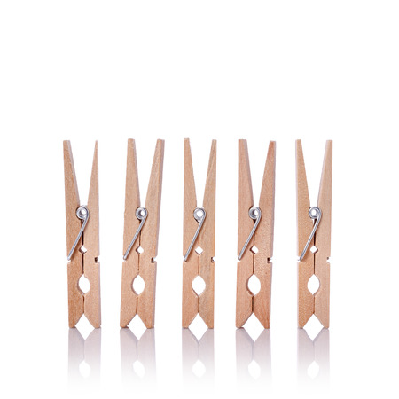 Wooden clothes pin. Studio shot isolated on white backgroundの写真素材