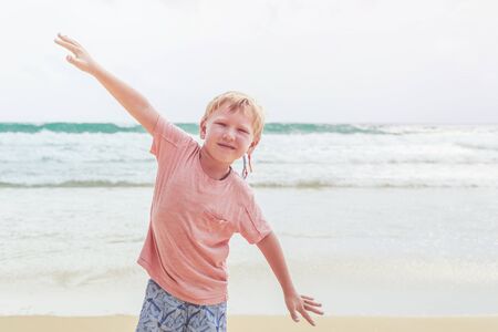 Caucasian boy from europe with happy and relax time on the tropical beach at Karon, Phuket province...