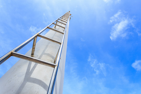 Close up high steel ladder on clear blue sky backgroundの写真素材