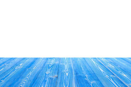 Empty top of blue wooden table or counter isolated on white background. For product displayの写真素材