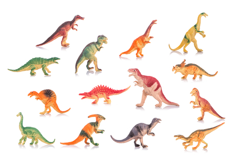 Collection of silicone or plastic toy dinosaurs. Studio shot and on white backgroundの写真素材
