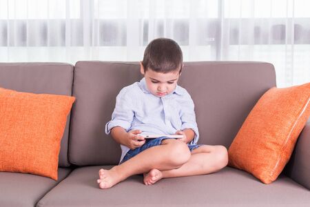 Caucasian family in status of serious. Woman worry and headache about her husband and son which only using smartphone. Using too much smartphone conceptの写真素材