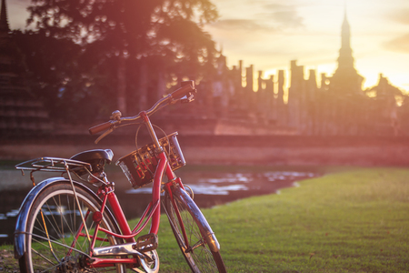 Vintage bicycle in Sukhothai Historical Park at Sunset time, Sukhothai province, Thailandの写真素材