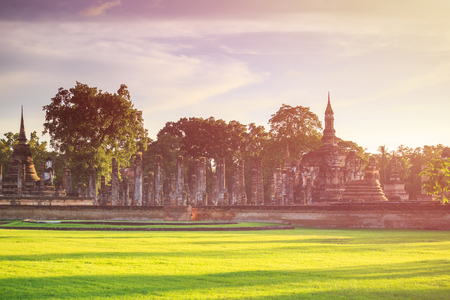 Sukhothai Historical Park at Sunset time, Sukhothai province, Located in a beautiful setting of lawns, lakes and trees in north-central of Thailandの写真素材