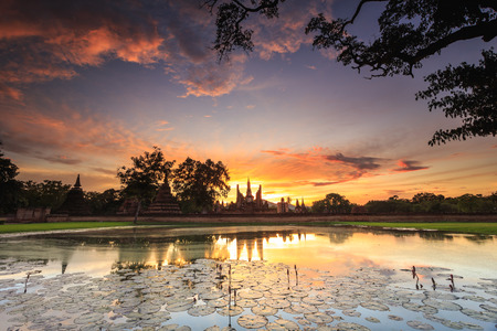 Sukhothai Historical Park at Sunset time, Sukhothai province, Located in a beautiful setting of lawns, lakes and trees in north-central of Thailandの写真素材