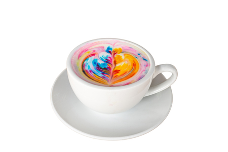 Top view of colorful rainbow latte coffee in white cup on wooden table with copy space for text or designの写真素材