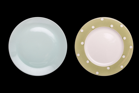 Top view two empty white new ceramic kitchen dish isolated on black background. Saved with clipping pathの写真素材