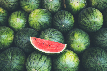Piece of fresh red slice watermelon on the heapの写真素材