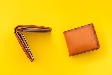 New leather brown men wallet on yellow background