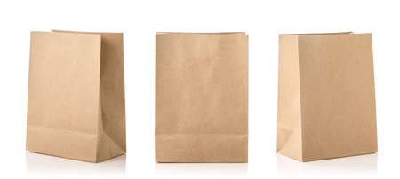 New blank brown paper bag for food packing. Studio shot isolated on white backgroundの写真素材