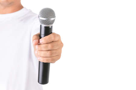 People holding black wireless microphone in studio. Isolated on white background