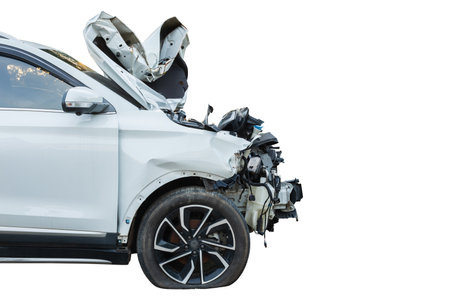 Car accident. Front side of white modern car get damaged by accident. Right empty space after crash for text or advertisement designの写真素材