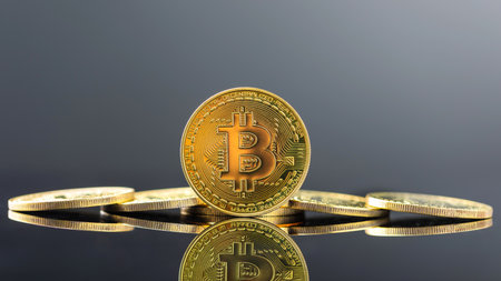 Bitcoin on dark background, Close up golden bitcoin a digital currency, operates on a decentralized system with transactions recorded and new units created without central authorityの写真素材