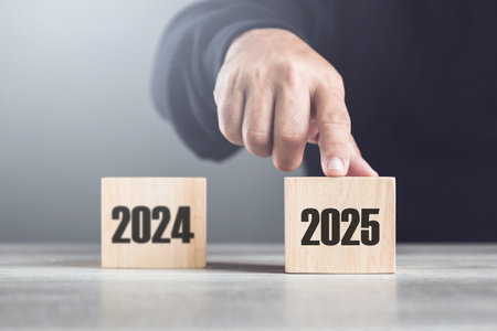Replaces "2024" with "2025" using number blocks, symbolizing the transition into the new year, representing change, progress, and the ongoing passage of timeの写真素材