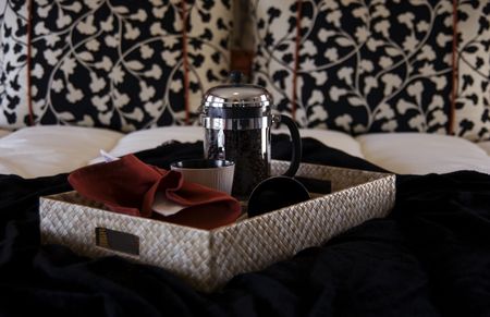 Beautiful bedroom with coffee tray on Bedの写真素材