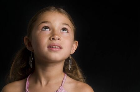 Little girl looking upの写真素材