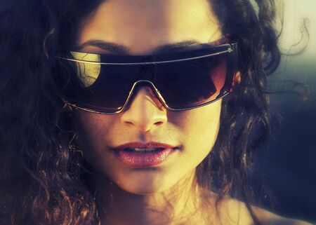 Young stylish sexy woman wearing sunglassesの写真素材