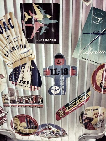 Luggage with travel flight stickers の素材