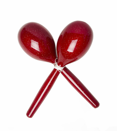 Red maracas a percussion instrument isolated on white