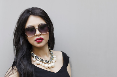 Elegant beautiful woman in black dressの写真素材