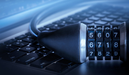 Lock on computer keyboard - data security concept image