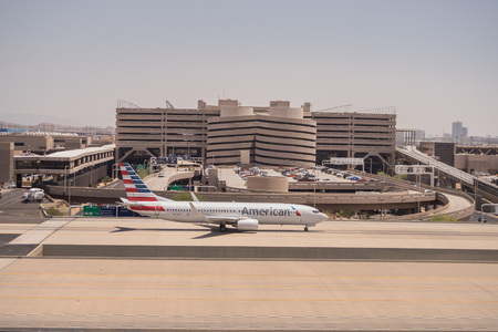 American Airlines parked at Phoenix SkyHarbor Airport.  May 28th 2016.  (Reuters) - Airport screenings caused more than 70,000 American Airlines customers to miss their flights in 2016.のeditorial素材