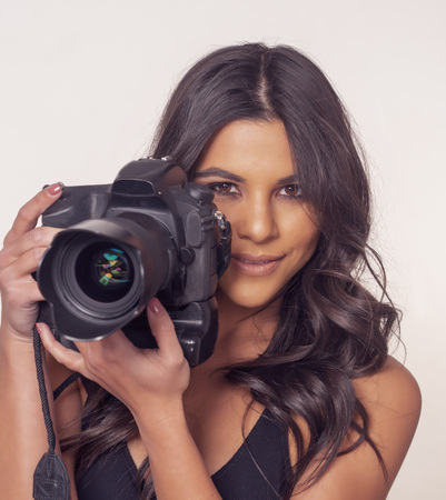 Woman using camera DSLRの写真素材