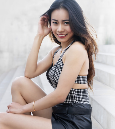 Beautiful young woman wearing leather skirt.の写真素材