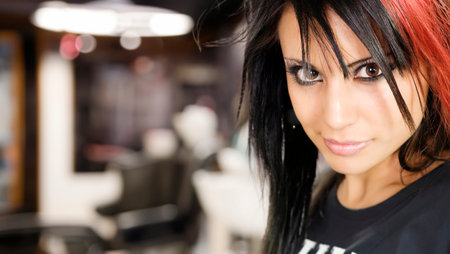 Beautiful young woman at the hairdresser's salon.の写真素材