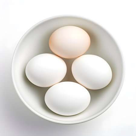 White eggs in a bowl on a white background.の素材