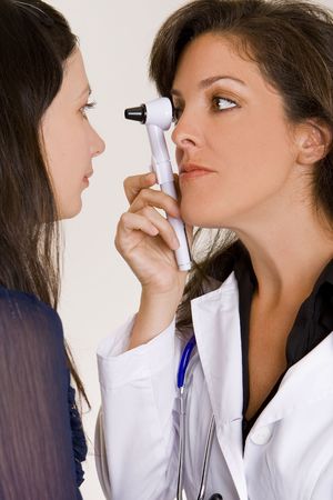Female doctor examining a patientの写真素材