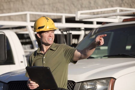 Attractive young construction worker with hardhat