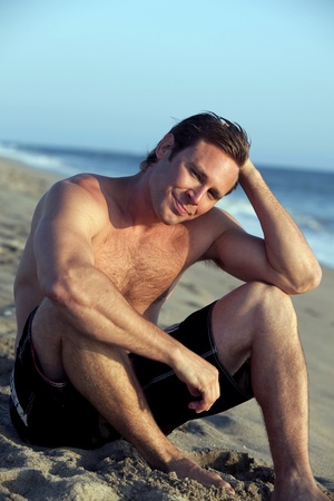 Young man at the beachの写真素材